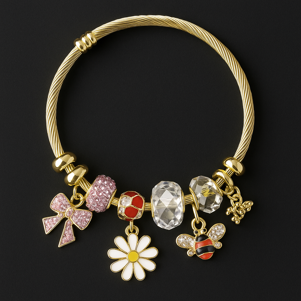 Gold bracelet with daisy, bee, and pink bow charms