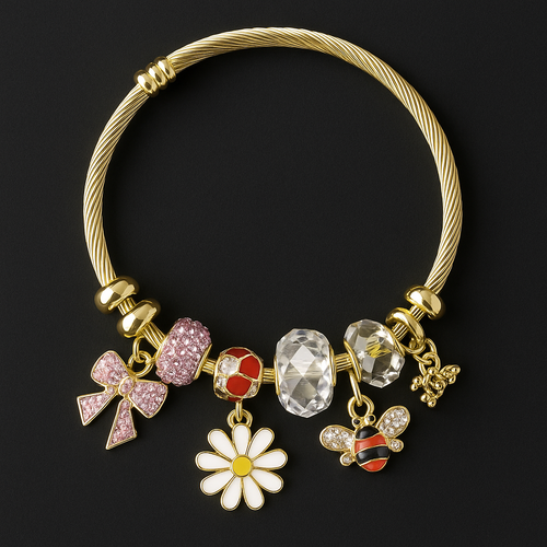 Gold bracelet with daisy, bee, and pink bow charms
